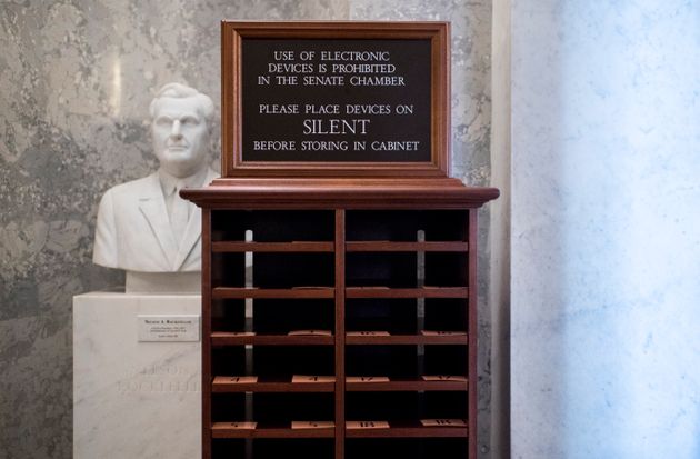 UNITED STATES - JANUARY 21: A storage unit for phone stands next to the entrance of the Senate chamber on Tuesday, Jan. 21, 2020. Electronic devices are not allowed in the chamber for the Senate impeachment trial. (Photo By Bill Clark/CQ-Roll Call, Inc via Getty Images)