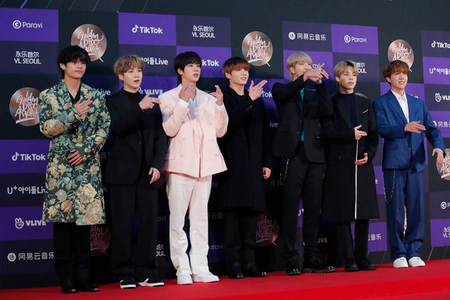 Members of South Korean K-Pop group BTS pose for photos during the Golden Disk Awards in Seoul, South Korea, Sunday, Jan. 5, 2020.(AP Photo/Ahn Young-joon)