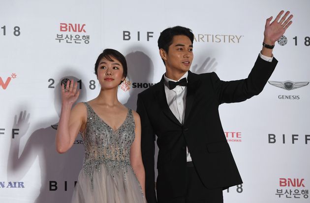 Japanese actor Daichi Watanabe (R) and actress Erika Karata (L) pose on the red carpet during the opening ceremony of the 23rd Busan International Film Festival (BIFF) at Busan Cinema Center in Busan on October 4, 2018. - The festival opens on October 4, with the world premiere of South Korean director Jero Yun's 'Beautiful Days', which focuses on a North Korean family reunited after the mother escapes south looking for a better life. (Photo by Jung Yeon-je / AFP)        (Photo credit should read JUNG YEON-JE/AFP via Getty Images)