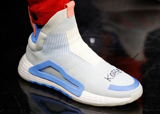 ATLANTA, GEORGIA - JANUARY 26:  A view of the shoes worn by Trae Young #11 of the Atlanta Hawks with Kobe Bryant's name written on them in his memory prior to facing the Washington Wizards at State Farm Arena on January 26, 2020 in Atlanta, Georgia.  NOTE TO USER: User expressly acknowledges and agrees that, by downloading and/or using this photograph, user is consenting to the terms and conditions of the Getty Images License Agreement.  (Photo by Kevin C. Cox/Getty Images)