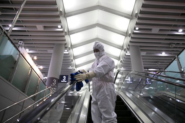 Workers from a cleaning and disinfection service spray disinfectant as part of efforts to prevent the spread of a new virus which originated in the Chinese city of Wuhan at Suseo railway station in Seoul on January 24, 2020. (Photo by Hong Yoon-gi / AFP) (Photo by HONG YOON-GI/AFP via Getty Images)