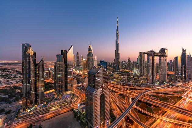 Dubai sky line with traffic junction and Burj Khalifa.