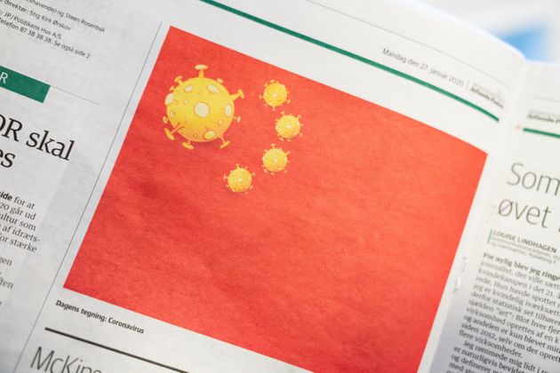 A cartoon of the coronavirus depicted as part of the Chinese national flag, is pictured in the Danish newspaper Jyllands-Posten's Monday January 27, 2020 edition, in Copenhagen, Denmark. Ritzau Scanpix/Ida Marie Odgaard via REUTERS ATTENTION EDITORS - THIS IMAGE WAS PROVIDED BY A THIRD PARTY. DENMARK OUT. NO COMMERCIAL OR EDITORIAL SALES IN DENMARK.
