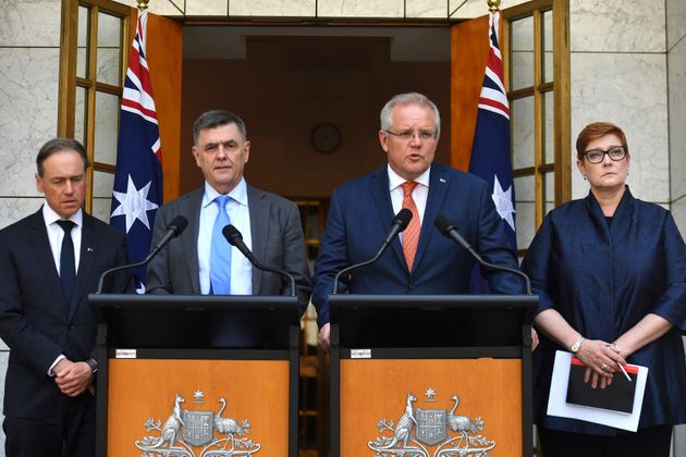 Australian Prime Minister Scott Morrison, second right, Minister for Health Greg Hunt, left, Chief Medical Officer Professor Brendan Murphy, and Minister for Foreign Affairs Marise Payne, right, give an update on the coronavirus at a press conference at Parliament House in Canberra, Wednesday, Jan. 29, 2020. (Mick Tsikas/AAP Image via AP)
