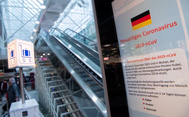 29 January 2020, Bavaria, Munich: Information about the corona virus can be seen at Munich Airport on an information display in the arrivals area. Photo: Sven Hoppe/dpa (Photo by Sven Hoppe/picture alliance via Getty Images)