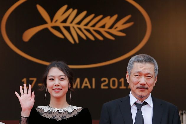 70th Cannes Film Festival - Screening of the film 'Geu-hu' (The Day After) in competition - Red Carpet Arrivals - Cannes, France. 22/05/2017. Director Hong Sang-soo (R) and cast member Kim Min-hee pose. REUTERS/Stephane Mahe