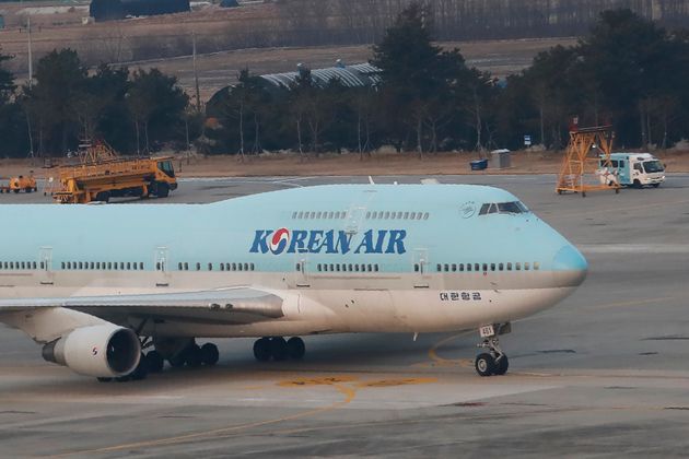 A South Korean chartered plane carrying evacuees from Wuhan, China, taxis after landing at Gimpo International Airport in Seoul, South Korea, Friday, Jan. 31, 2020. (AP Photo/Ahn Young-joon)