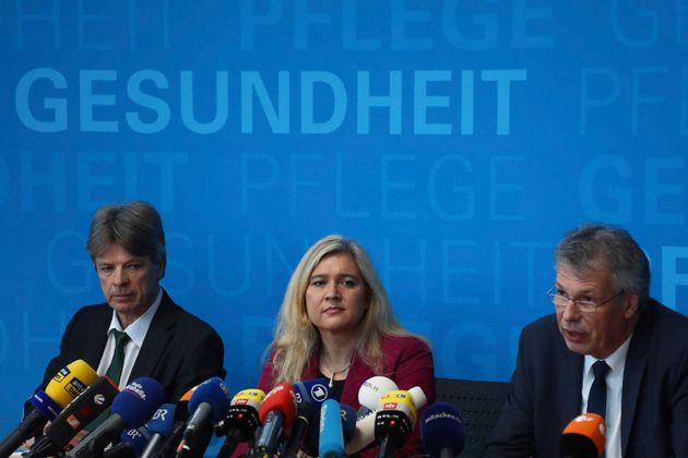 Bavarian state minister for health and nursing Melanie Huml, center, and President of the Bavarian state office for health and food safety Dr. Andreas Zapf brief the media during a news conference, Munich, Germany, Tuesday, Jan. 28, 2020. Germany has declared its first confirmed case of the deadly coronavirus that broke out in China. (AP Photo/Matthias Schrader)