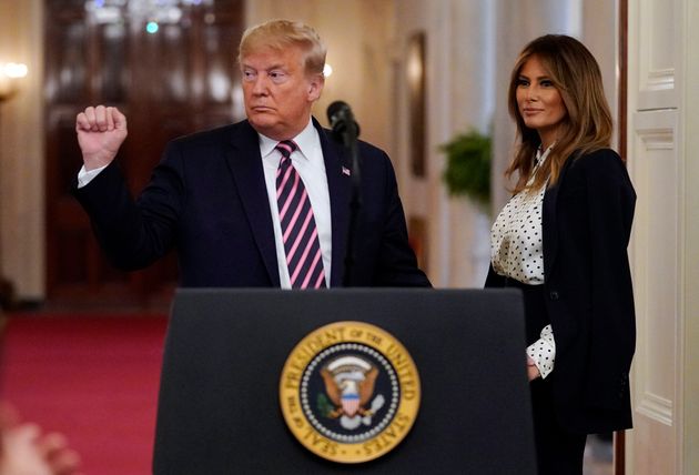 President Donald Trump gestures as he speaks in the East Room of the White House, Thursday, Feb. 6, 2020, in Washington, as first lady Melania Trump looks on. (AP Photo/Evan Vucci)