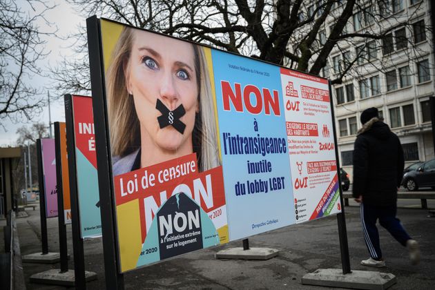 A campaign poster showing gagged Swiss MP Celine Amaudruz of right wing populist Swiss People's Party and asking Swiss voters in a referendum to reject a proposed ban on discrimination based on sexual orientation, charging it will lead to censorship, is seen on a billboard in Geneve, on January 30, 2020. - For gay rights campaigner Jean-Pierre Sigrist, the new law being voted on in a referendum in Switzerland on Sunday might have stopped him getting beaten up four decades ago. (Photo by Fabrice COFFRINI / AFP) (Photo by FABRICE COFFRINI/AFP via Getty Images)