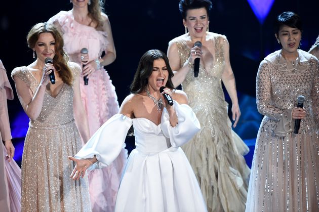 Idina Menzel, center, performs with international voice actresses that play Elsa in the movie 'Frozen II' at the Oscars on Sunday, Feb. 9, 2020, at the Dolby Theatre in Los Angeles. (AP Photo/Chris Pizzello)
