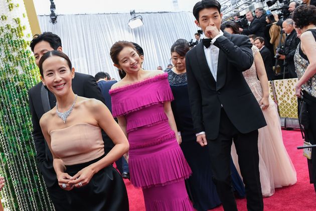 Actors of the Korean movie Parasite Yeo-jeong Jo (L), So Dam Park (C) and Woo-Sik Choi arrive for the 92nd Oscars at the Dolby Theatre in Hollywood, California on February 9, 2020. (Photo by VALERIE MACON / AFP) (Photo by VALERIE MACON/AFP via Getty Images)