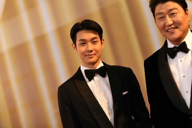 Korean actors Choi Woo Sik and Kong-Ho Song from 'Parasite' arrive for the 92nd Oscars at the Dolby Theatre in Hollywood, California on February 9, 2020. (Photo by VALERIE MACON / AFP) (Photo by VALERIE MACON/AFP via Getty Images)
