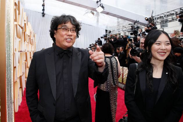 South Korean director Bong Joon-ho (L) of 'Parasite' poses on the red carpet during the Oscars arrivals at the 92nd Academy Awards in Hollywood, Los Angeles, California, U.S., February 9, 2020. REUTERS/Mike Blake