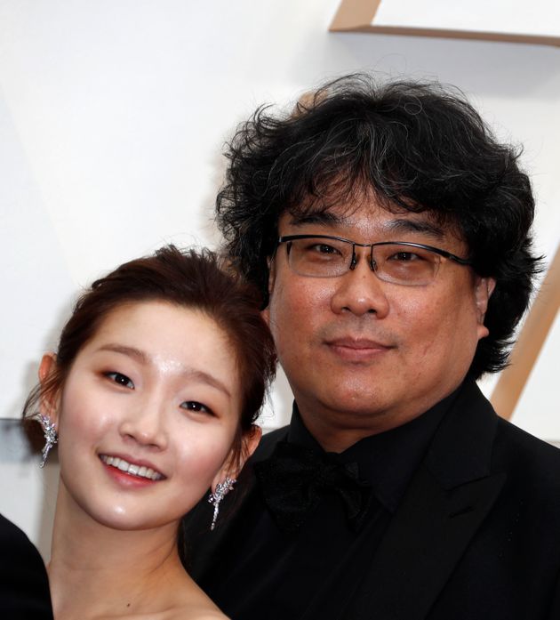 Park So-dam (L) and Bong Joon-ho, director of 'Parasite,' from South Korea, pose on the red carpet during the Oscars arrivals at the 92nd Academy Awards in Hollywood, Los Angeles, California, U.S., February 9, 2020. REUTERS/Eric Gaillard