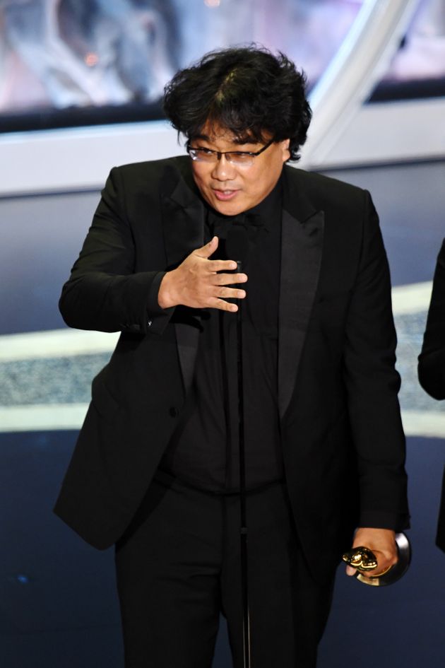 HOLLYWOOD, CALIFORNIA - FEBRUARY 09: Bong Joon-ho accepts the Writing - Original Screenplay - award for 'Parasite' onstage during the 92nd Annual Academy Awards at Dolby Theatre on February 09, 2020 in Hollywood, California. (Photo by Kevin Winter/Getty Images)