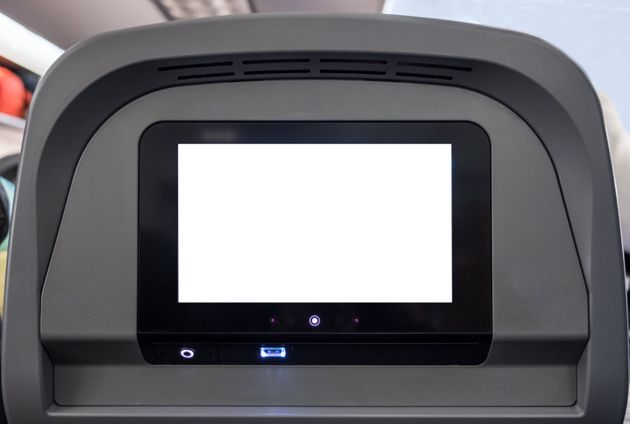 White display entertain screen with button and channel on rear seat in passenger plane