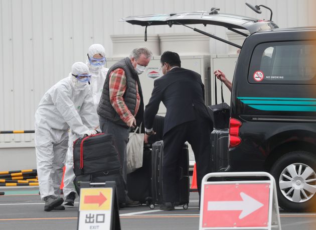 A passenger's luggages are loaded into a vehicle after disembarking the coronavirus-hit Diamond Princess cruise ship docked at Yokohama Port, south of Tokyo, Japan, February 20, 2020. REUTERS/Kim Kyung-Hoon