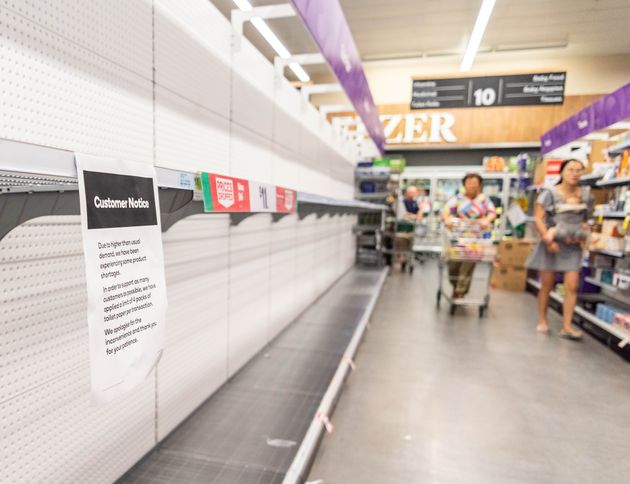 BRISBANE, AUSTRALIA - 2020/03/04: Customers looks at empty shelves at a supermarket.
Shops sold out on many goods including toilet paper and canned food after Coronavirus spread in Australia. Population stocked up after fear of national shortage on food and supplies. (Photo by Florent Rols/SOPA Images/LightRocket via Getty Images)
