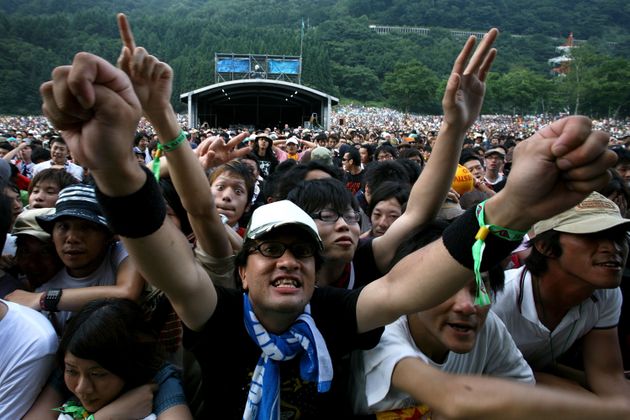 YUZAWA, JAPAN - JULY 26:  Fans attend the Fuji Rock festival at Naeba Ski Resort on July 26, 2008 in Yuzawa, Niigata, Japan.  (Photo by Kiyoshi Ota/Getty Images)
