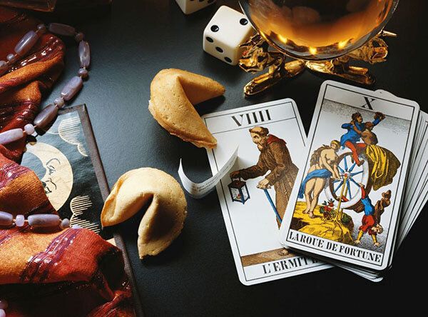 Tarot cards, fortune cookies, palmistry, and crystal ball