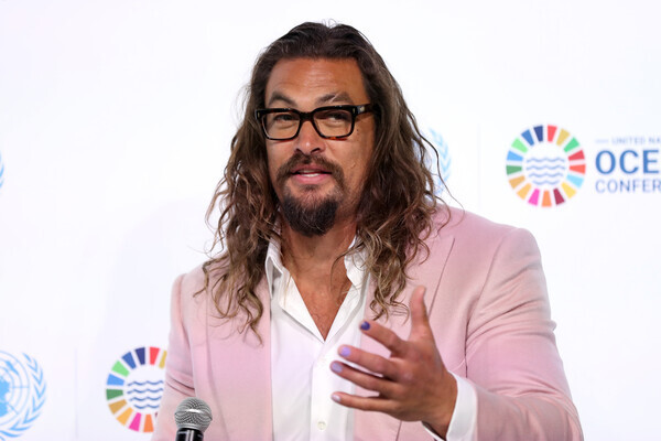 US Movie star and ocean activist Jason Momoa speaks during the United Nations Oceans Conference in Lisbon, Portugal, on June 27, 2022.  (Photo by Pedro Fiúza/NurPhoto via Getty Images)