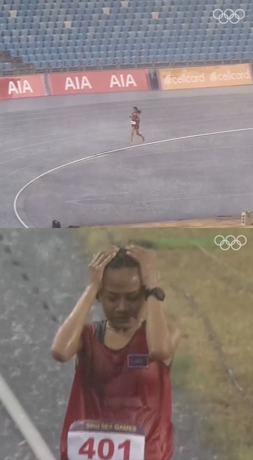 폭우 쏟아지는 와중에도 끝까지 레이스 이어간 캄보디아 육상선수 보우 삼낭. ⓒ'The Olympic Games' 트위터 공식 계정