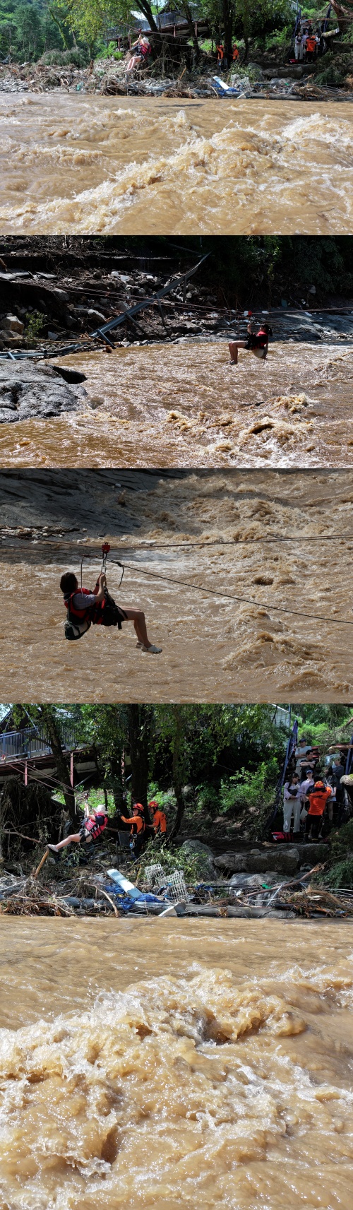 로프타고 탈출하는 캠핑장 시민들. ⓒ뉴스1